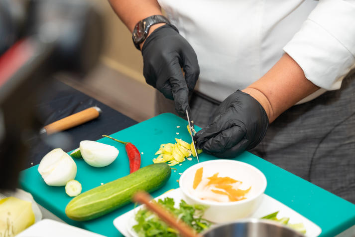 Restaurant and Catering Management students engaged in a signature Bánh mì workshop guided by a culinary expert 58