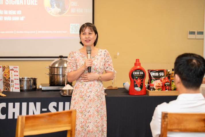 Restaurant and Catering Management students engaged in a signature Bánh mì workshop guided by a culinary expert 17