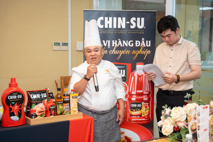 Restaurant and Catering Management students engaged in a signature Bánh mì workshop guided by a culinary expert 28