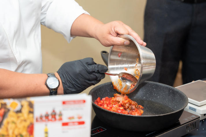 Restaurant and Catering Management students engaged in a signature Bánh mì workshop guided by a culinary expert 51