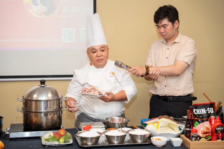 Restaurant and Catering Management students engaged in a signature Bánh mì workshop guided by a culinary expert 46
